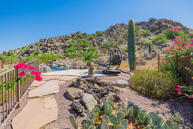 view of yard featuring a mountain view and a patio area