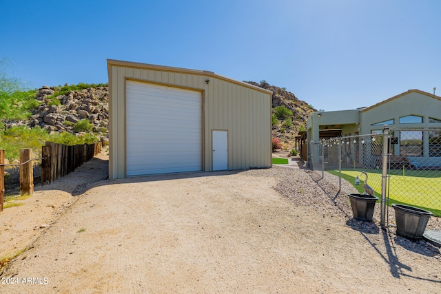 garage featuring a lawn