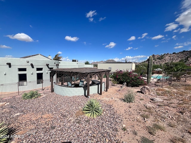 back of house with a mountain view and a gazebo