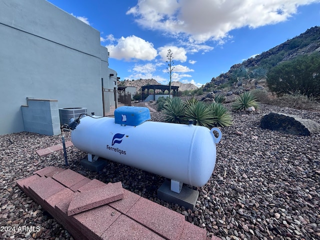 exterior details featuring central AC unit and a mountain view