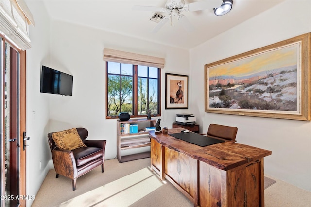 home office featuring ceiling fan and light colored carpet