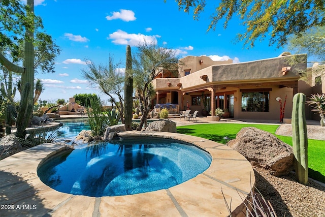 view of pool featuring a patio