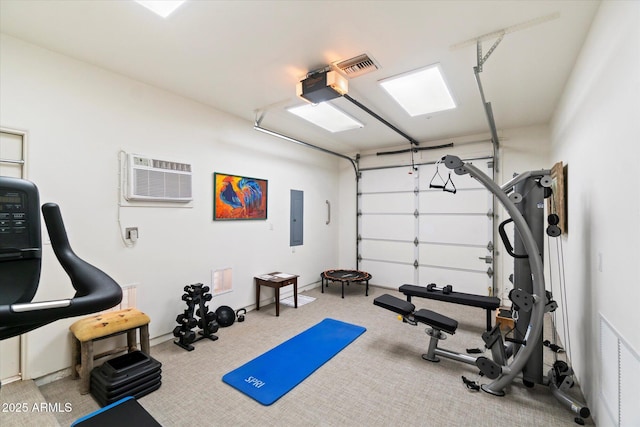 workout area featuring electric panel and a wall unit AC