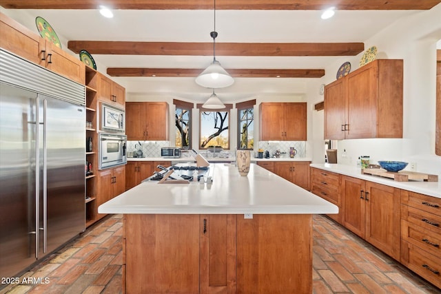 kitchen with backsplash, built in appliances, a kitchen island, decorative light fixtures, and beamed ceiling