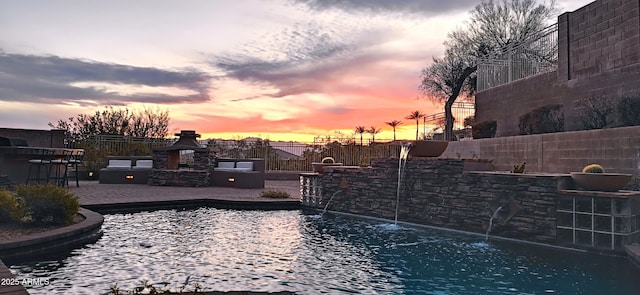136 E Desert Wind Dr, Phoenix, AZ 85048 - view of pool with a patio, a fenced backyard, and a fireplace
