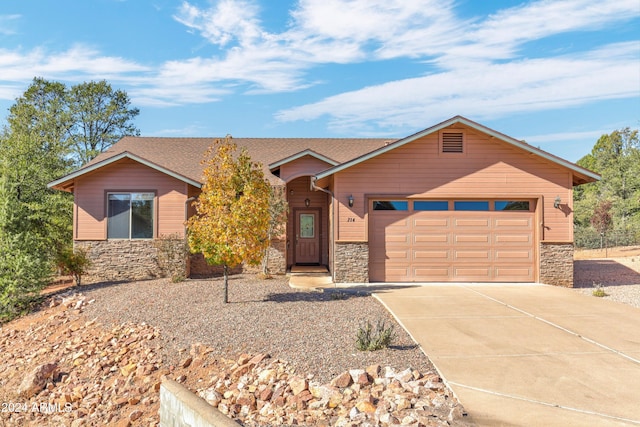 ranch-style home featuring a garage