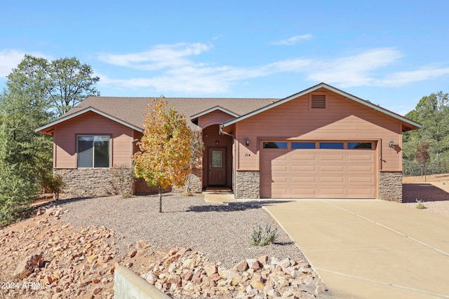 ranch-style home featuring a garage