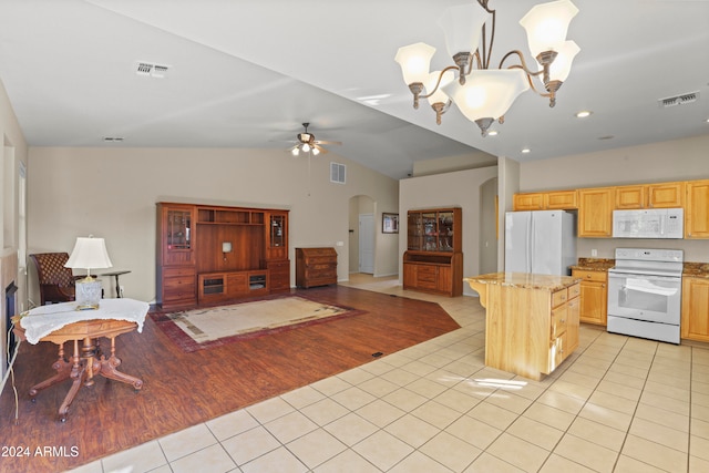 kitchen with lofted ceiling, white appliances, hanging light fixtures, light wood-type flooring, and a kitchen island