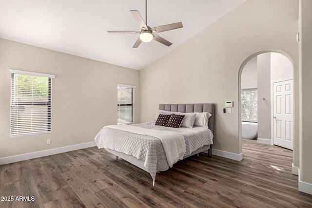 bedroom featuring arched walkways, high vaulted ceiling, baseboards, and dark wood-style flooring