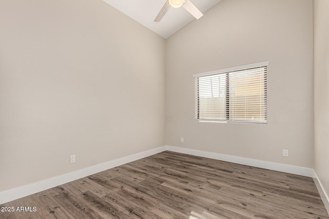 empty room featuring ceiling fan, high vaulted ceiling, baseboards, and wood finished floors