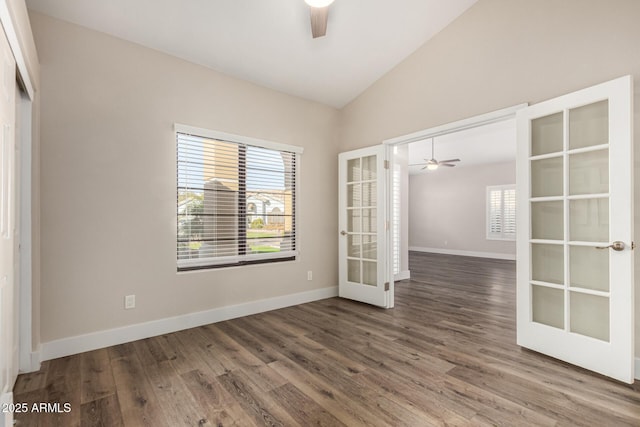 spare room with a wealth of natural light, french doors, a ceiling fan, and lofted ceiling