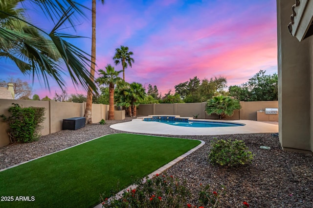 yard at dusk featuring a patio area, a fenced in pool, and a fenced backyard