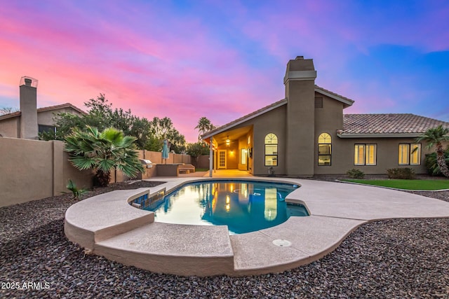 view of swimming pool with a patio area, a fenced in pool, and a fenced backyard