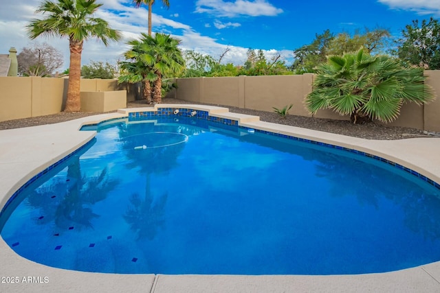 view of swimming pool featuring a fenced in pool and a fenced backyard