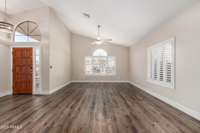 entrance foyer with visible vents, baseboards, dark wood finished floors, lofted ceiling, and ceiling fan with notable chandelier