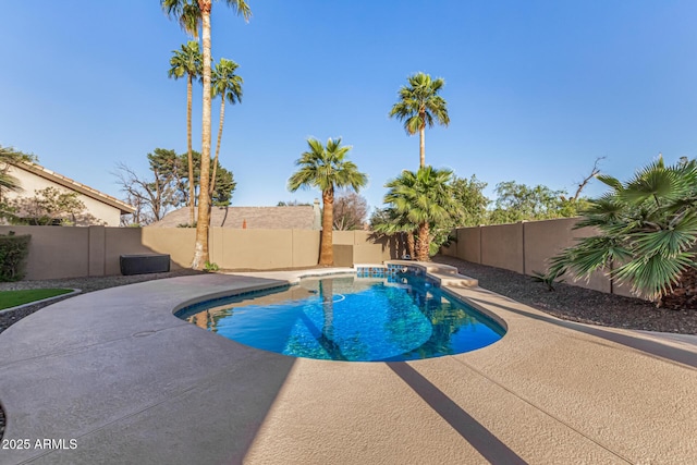 view of swimming pool with a patio area, a fenced in pool, and a fenced backyard