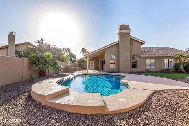 view of swimming pool featuring a patio area, a fenced in pool, a ceiling fan, and a fenced backyard