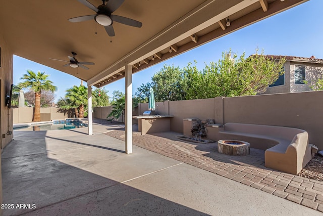 view of patio / terrace featuring a fenced in pool, an outdoor fire pit, and a fenced backyard