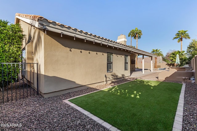 exterior space featuring a patio area and a fenced backyard