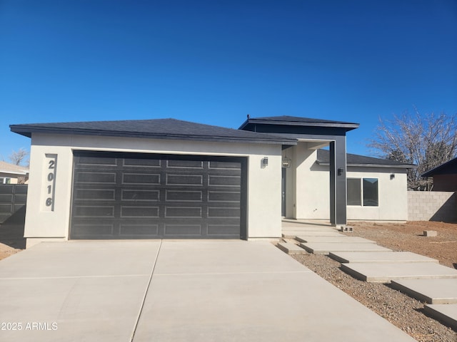 prairie-style house featuring a garage