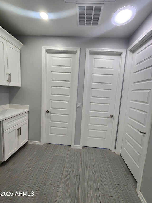 interior space featuring white cabinets