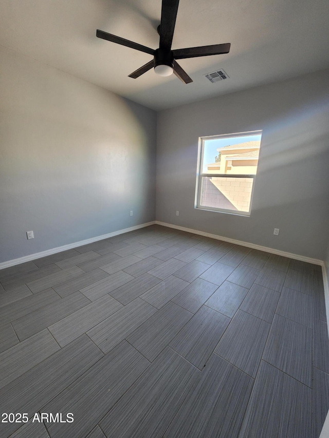 unfurnished room with ceiling fan