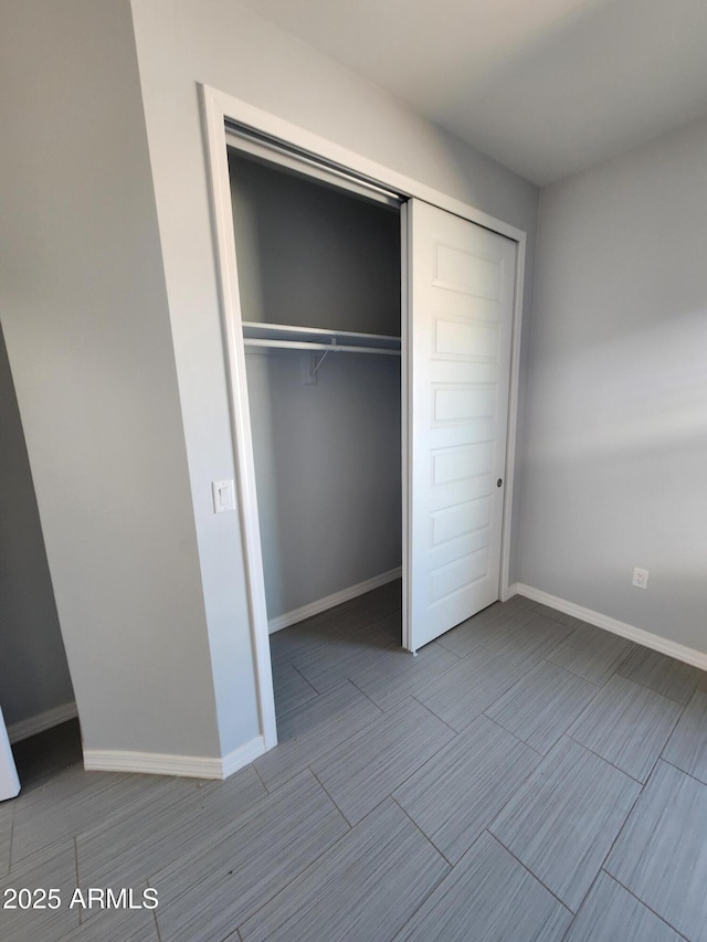 unfurnished bedroom with a closet