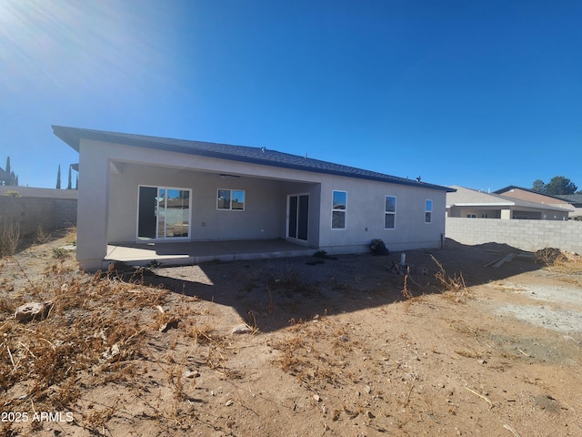 rear view of house featuring a patio