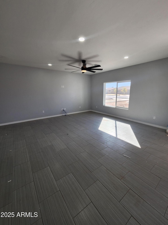 empty room featuring ceiling fan