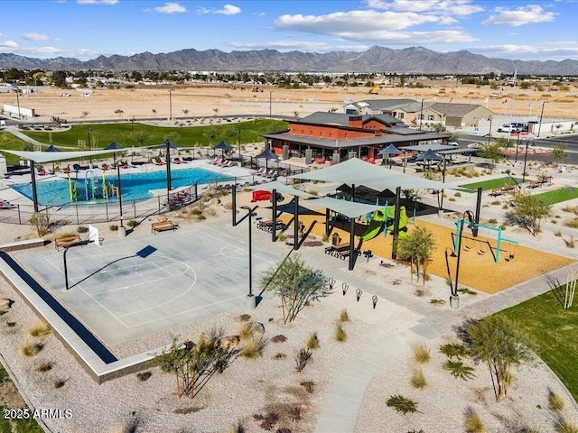 birds eye view of property with a mountain view