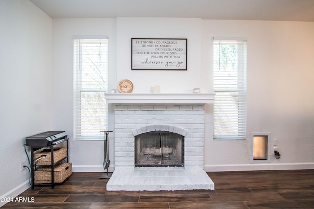 details featuring wood-type flooring and a brick fireplace