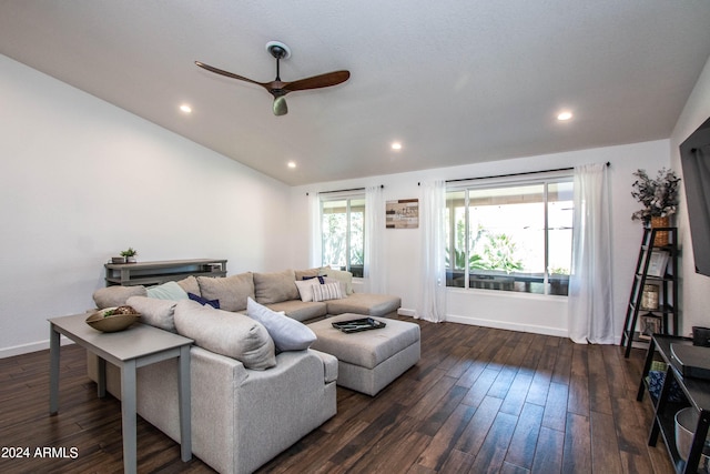 living room with dark hardwood / wood-style flooring, vaulted ceiling, and ceiling fan