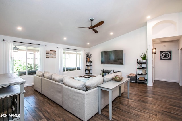 living room with dark wood-type flooring, ceiling fan, a wealth of natural light, and vaulted ceiling