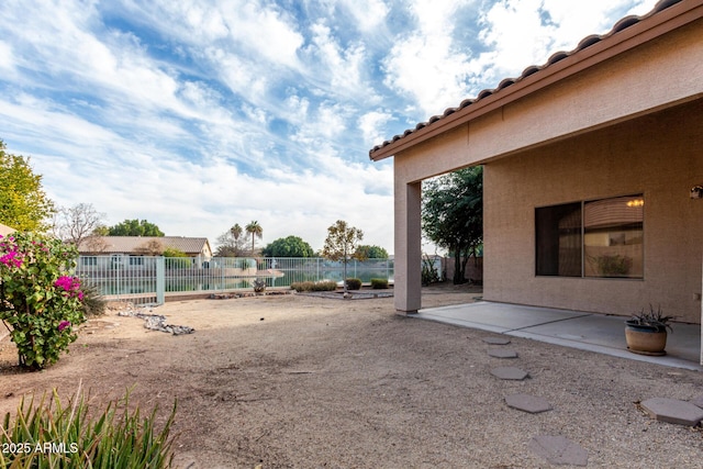 view of yard with a patio and fence