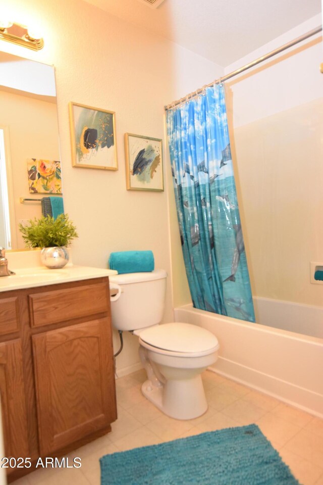 full bathroom with tile patterned floors, toilet, vanity, and shower / bathtub combination with curtain