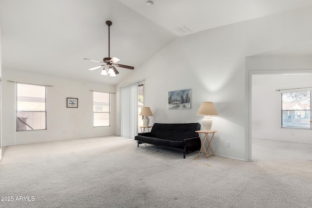 living area featuring a healthy amount of sunlight, visible vents, and carpet floors