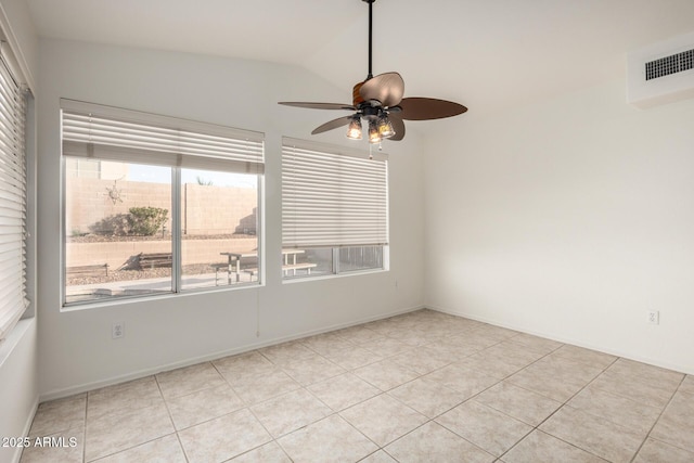 unfurnished room with ceiling fan, light tile patterned floors, visible vents, lofted ceiling, and baseboards