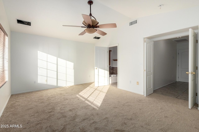 interior space featuring lofted ceiling, visible vents, and ceiling fan