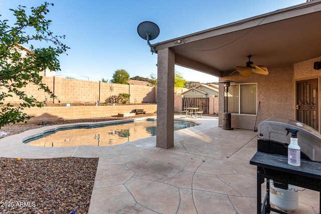 view of patio / terrace featuring a fenced backyard, ceiling fan, and a fenced in pool