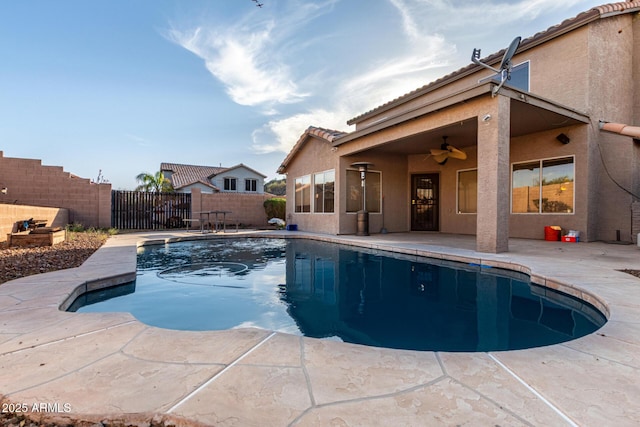 view of pool with a patio area, a fenced backyard, ceiling fan, and a fenced in pool