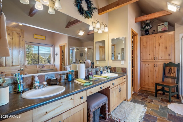 bathroom featuring lofted ceiling with beams, vanity, and walk in shower