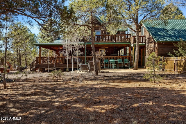 back of property featuring a wooden deck