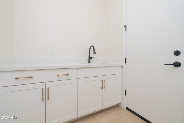 1254 E Penedes Dr, Gilbert, AZ 85298 - bar with a sink and light wood finished floors
