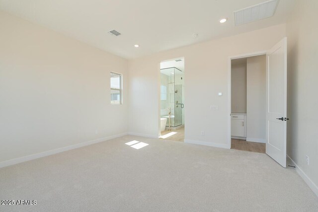 1254 E Penedes Dr, Gilbert, AZ 85298 - unfurnished bedroom with light carpet, baseboards, recessed lighting, and ensuite bathroom