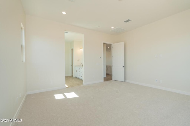 1254 E Penedes Dr, Gilbert, AZ 85298 - unfurnished bedroom featuring light colored carpet, baseboards, recessed lighting, and connected bathroom