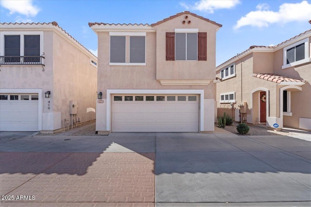 421 W Mountain Sage Dr, Phoenix, AZ 85045 - mediterranean / spanish house with stucco siding, concrete driveway, a tile roof, and a garage