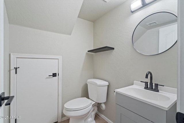 421 W Mountain Sage Dr, Phoenix, AZ 85045 - half bathroom featuring vanity, toilet, baseboards, and vaulted ceiling