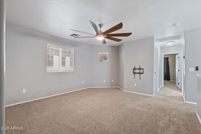 421 W Mountain Sage Dr, Phoenix, AZ 85045 - spare room with ceiling fan, light colored carpet, baseboards, and attic access