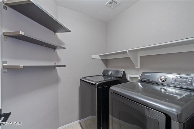 421 W Mountain Sage Dr, Phoenix, AZ 85045 - washroom featuring separate washer and dryer and baseboards