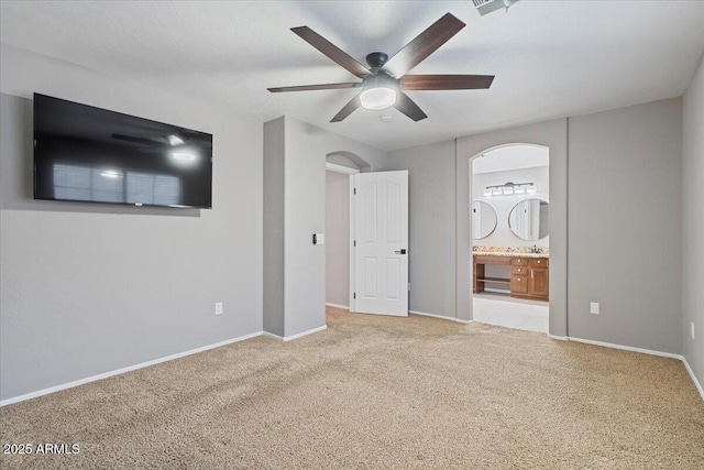 421 W Mountain Sage Dr, Phoenix, AZ 85045 - unfurnished bedroom with carpet floors, baseboards, connected bathroom, and a ceiling fan